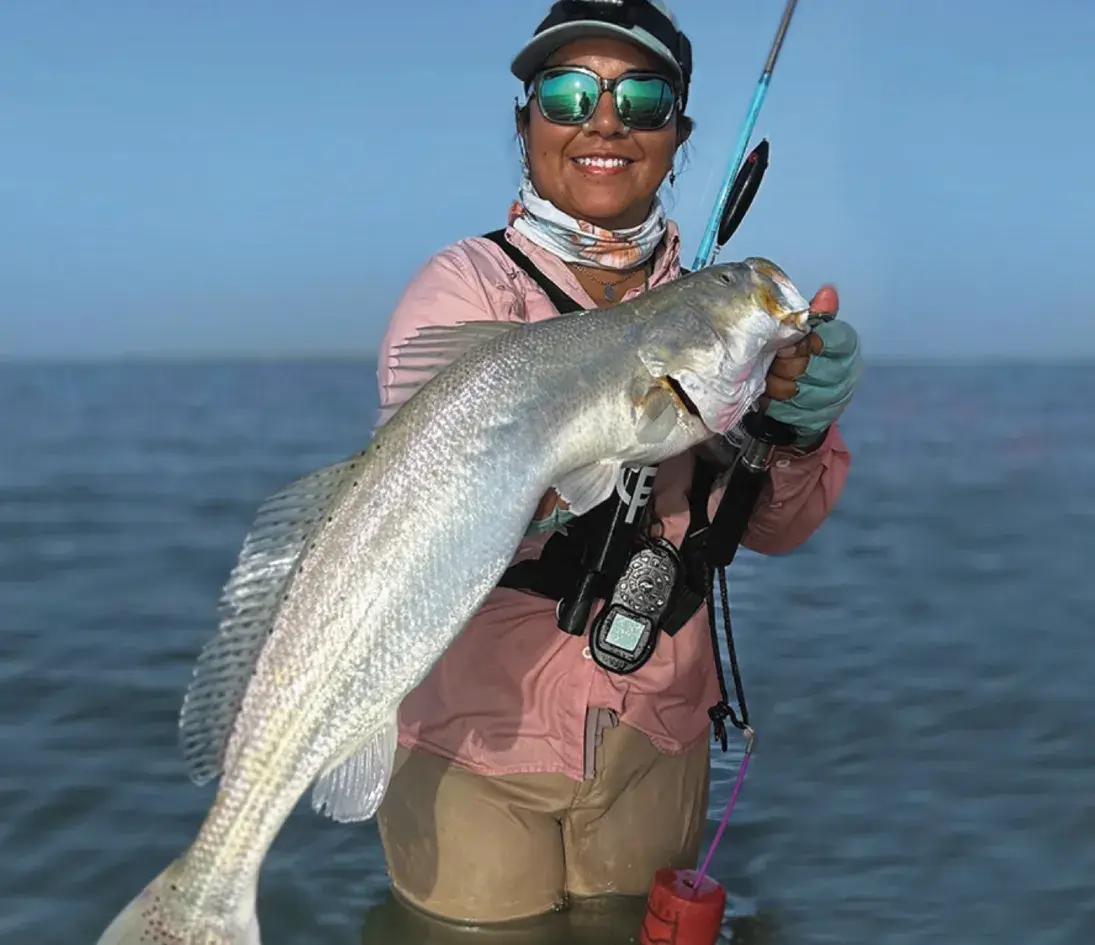 Capt. Reanna with her personal best trout 